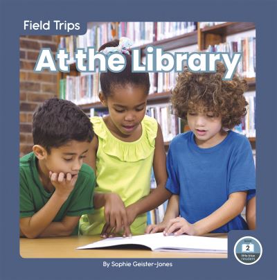 At the Library. Paperback